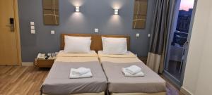 Postel nebo postele na pokoji v ubytování Ariston Hotel