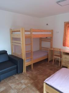 Llit o llits en una habitació de Penzion U Pavla