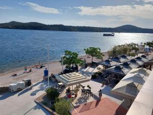 an aerial view of a beach with a boat in the water at Apartment Polic in Šibenik