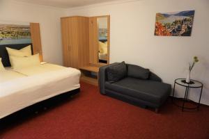 Postel nebo postele na pokoji v ubytování Hotel Jan van Werth