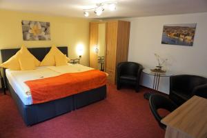 Postel nebo postele na pokoji v ubytování Hotel Jan van Werth