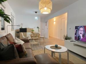 a living room with a couch and a table at Casa Rural La Peña in Tarifa