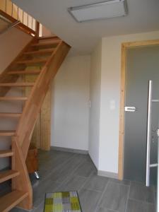 a room with a staircase in a house at Ferienwohnung-Pension Werrablick in Witzenhausen