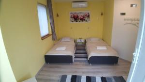 Postel nebo postele na pokoji v ubytování Bubble House - Apartmanok