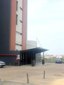 a building with a black cover in a parking lot at Quayside 606 Durban Point in Durban