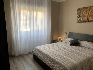 Postel nebo postele na pokoji v ubytování Appartamento Lucia, Lago di Como, Dongo