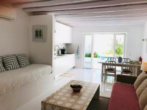 a living room with a couch and a table at Casa Ana in Tavira
