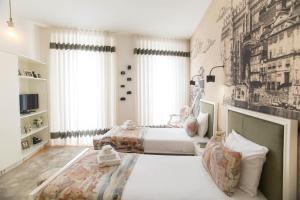 Ένα ή περισσότερα κρεβάτια σε δωμάτιο στο Aliados Downtown Studio by Porto City Hosts