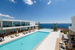an image of a swimming pool at a hotel at Empire Beach Resort ADULTS ONLY in Dhërmi