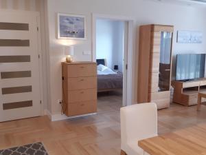 Posteľ alebo postele v izbe v ubytovaní Apartamenty przy Stoku Mrągowo