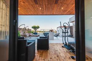 a room with a gym with a view of the pool at RESIDENCE Apartments in Ulcinj