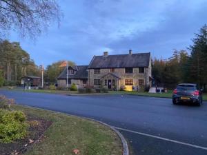 a car is parked in front of a house at Hot Tub 9 The Fairways in Alnwick