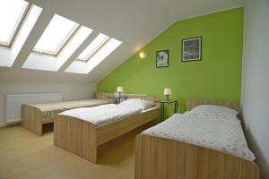 En eller flere senge i et værelse på Magnat w Borczu