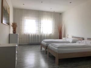 Postel nebo postele na pokoji v ubytování Apartmán Hrušky