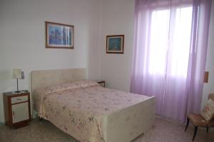 En eller flere senge i et værelse på Casa DUILIA