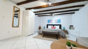 a bedroom with a bed and a table in a room at Studio Tony in Dubrovnik