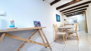 a kitchen and dining room with a table and chairs at Studio Tony in Dubrovnik