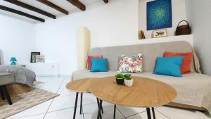 a living room with a couch and a table at Studio Tony in Dubrovnik