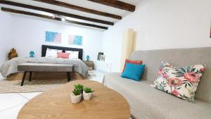 a living room with a couch and a bed at Studio Tony in Dubrovnik