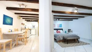 a bedroom and kitchen with a bed and a table at Studio Tony in Dubrovnik