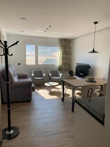 a living room with a couch and a table at Casa Raquel,caminito del Rey in Valle de Abdalagís