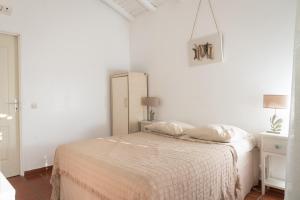Postel nebo postele na pokoji v ubytování Hôtel Les Bananiers