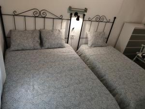 Postel nebo postele na pokoji v ubytování Casa Centro Jérica