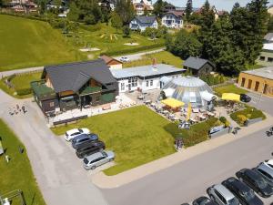 an aerial view of a house with cars parked in a parking lot at Semmering Loft in Semmering