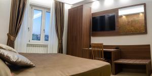 TV a/nebo společenská místnost v ubytování B&B Le Ninfee