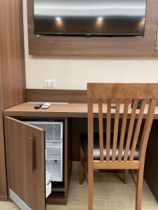 TV a/nebo společenská místnost v ubytování B&B Le Ninfee