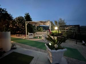 a backyard with a green lawn and a tent at Villa Rosa in Agropoli