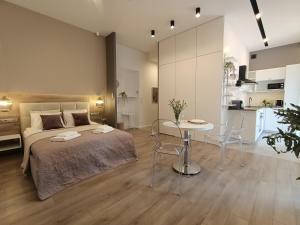 Posteľ alebo postele v izbe v ubytovaní MyFive Apartments Kraków