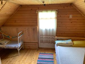Postel nebo postele na pokoji v ubytování Садиба «Під Горбом»