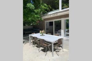 a white table and chairs on a patio at PARK Loft @ BRUGES with private (free) parking in Bruges +5 photos
