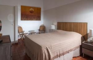 Postel nebo postele na pokoji v ubytování Hôtel Les Bananiers