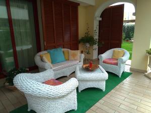 a living room filled with furniture and a patio at Gemma Di Gallura Charme B&B in Olbia