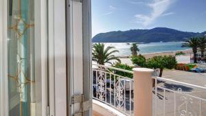 a balcony with a view of the beach at Azure Mare Studios in Corfu Town