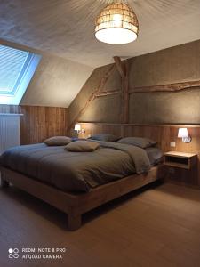 Voodi või voodid majutusasutuse Le vieux tilleul toas