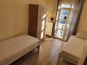 Een bed of bedden in een kamer bij Maison au calme à 300m de la plage