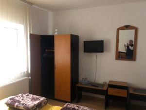 a man taking a picture of a room at Casa Cleopatra 2 MAI in 2 Mai