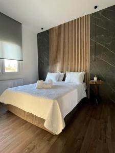 Ένα ή περισσότερα κρεβάτια σε δωμάτιο στο Lf Suites - Irene