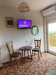 A television and/or entertainment centre at Piroska Apartment