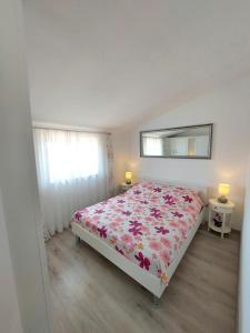 Postel nebo postele na pokoji v ubytování Apartman Ana
