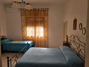 Postel nebo postele na pokoji v ubytování Villa Cino