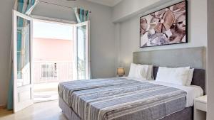 Posteľ alebo postele v izbe v ubytovaní Azure Mare Studios + 37 fotografií