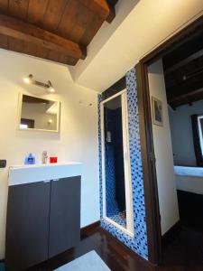 a bathroom with a sink and a mirror at Casale Pratoterra in Bracciano +62 photos
