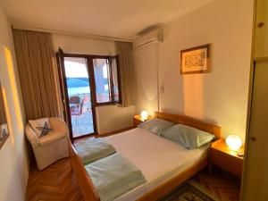 Postel nebo postele na pokoji v ubytování Apartments Stella-Dora
