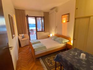 Postel nebo postele na pokoji v ubytování Apartments Stella-Dora