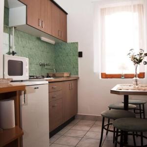 Kuchyňa alebo kuchynka v ubytovaní Kispál Apartmanház
