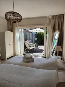 En eller flere senge i et værelse på Studio Broeckestraat 12